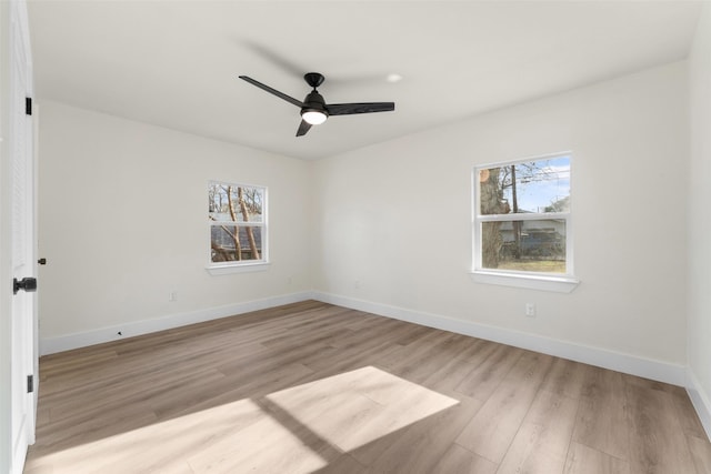 spare room with ceiling fan and light hardwood / wood-style floors