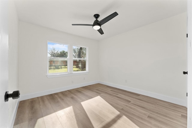 empty room featuring ceiling fan and light hardwood / wood-style floors