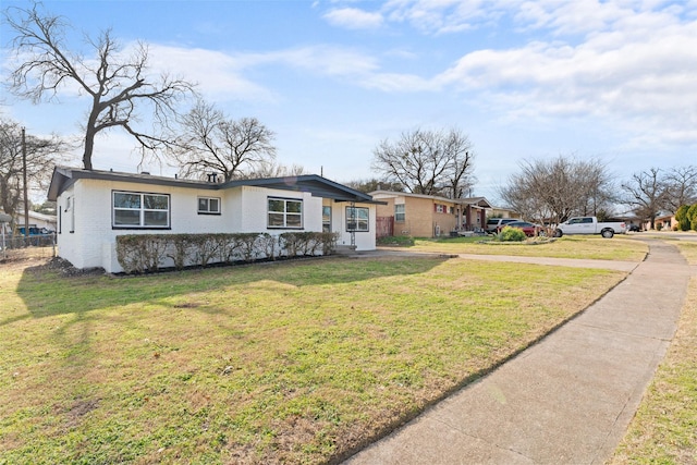 single story home featuring a front yard