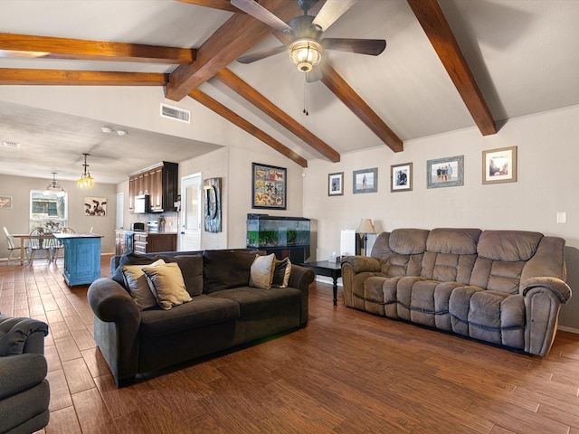 living room featuring ceiling fan, dark wood-type flooring, and vaulted ceiling with beams