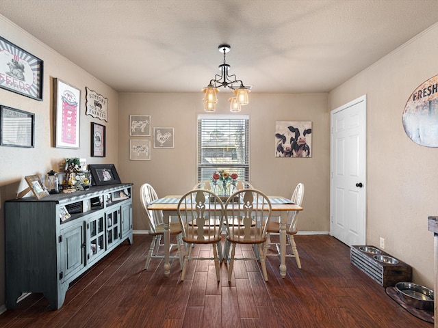 dining space with a textured ceiling, a notable chandelier, and dark hardwood / wood-style floors