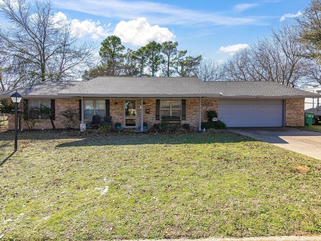 single story home with a garage and a front lawn