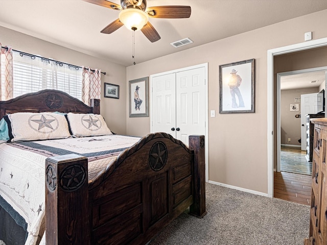 bedroom featuring ceiling fan, a closet, and carpet