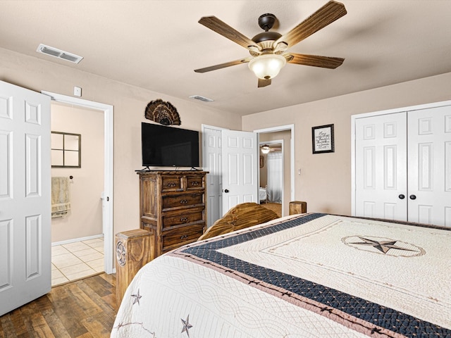 bedroom featuring hardwood / wood-style flooring, ceiling fan, and a closet