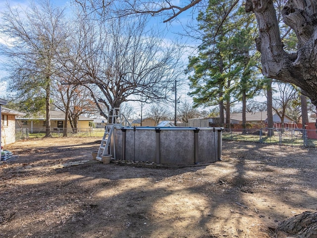 view of yard featuring a fenced in pool