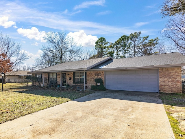 single story home featuring a porch, a front lawn, and a garage