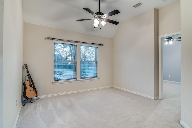 unfurnished room featuring ceiling fan, lofted ceiling, and light carpet