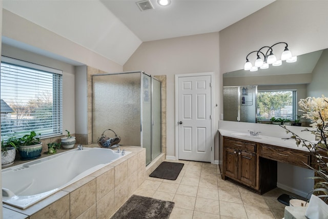 bathroom featuring vanity, shower with separate bathtub, tile patterned flooring, and vaulted ceiling