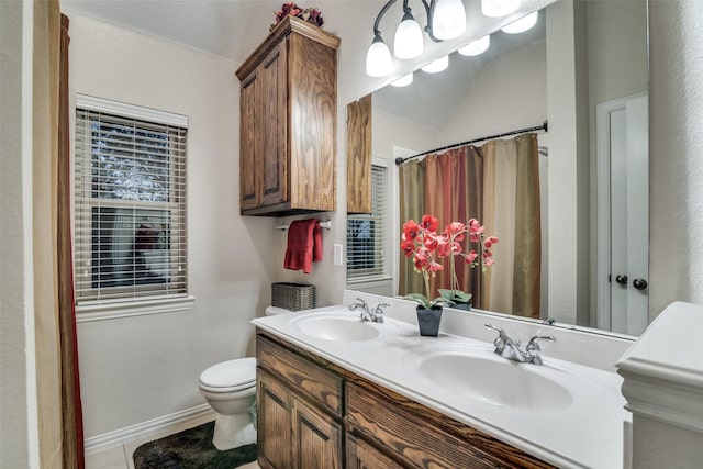 bathroom with tile patterned floors, vanity, and toilet