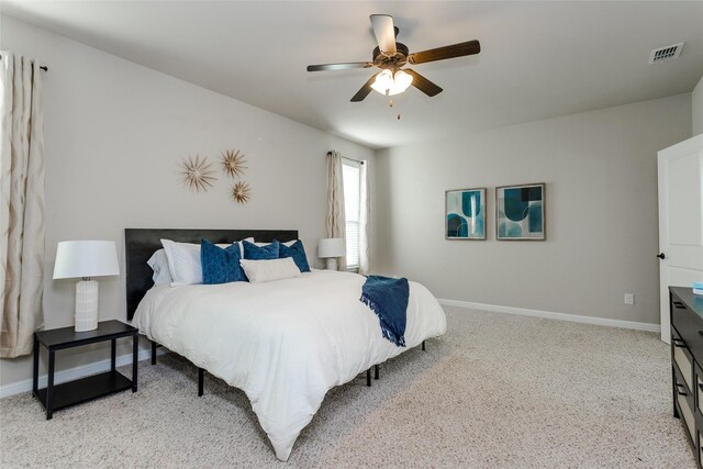 bedroom featuring light colored carpet and ceiling fan