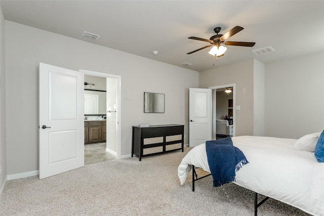 carpeted bedroom featuring ceiling fan and connected bathroom