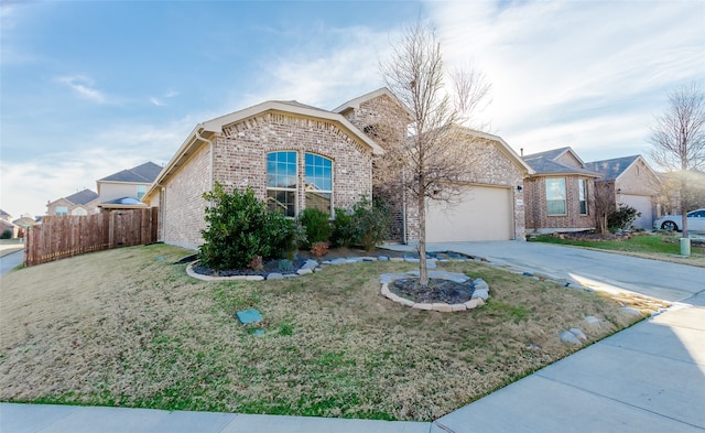 view of front of home featuring a front yard and a garage