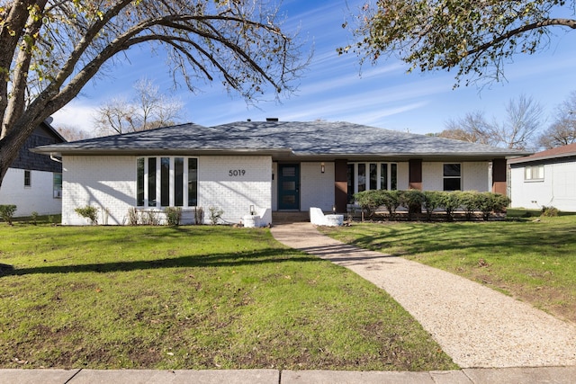 ranch-style home featuring a front yard