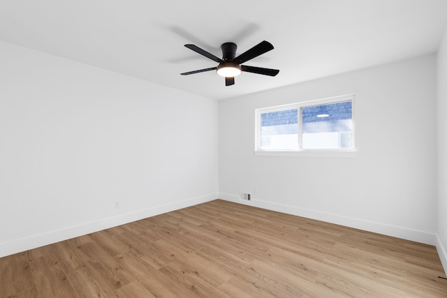 spare room featuring ceiling fan and light wood-type flooring