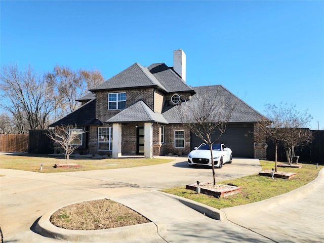 view of front of house featuring an attached garage, a shingled roof, fence, driveway, and a chimney