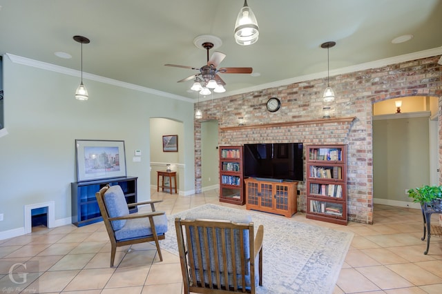 tiled living room with ceiling fan and crown molding