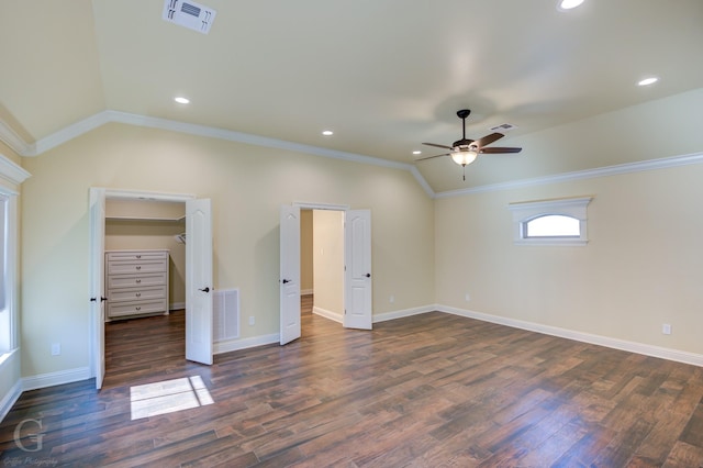 unfurnished bedroom featuring lofted ceiling, ceiling fan, crown molding, and dark hardwood / wood-style floors