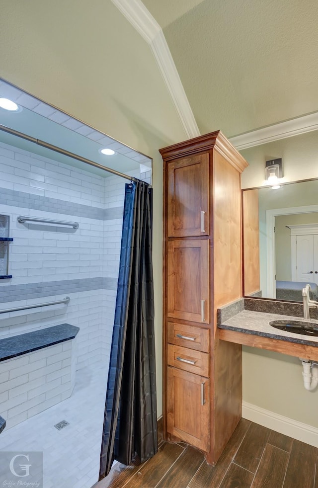 bathroom with crown molding, vanity, and a shower with curtain