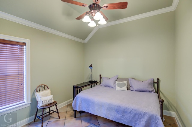 tiled bedroom with lofted ceiling, ornamental molding, and ceiling fan