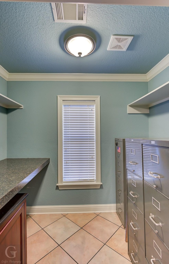 spacious closet featuring light tile patterned floors