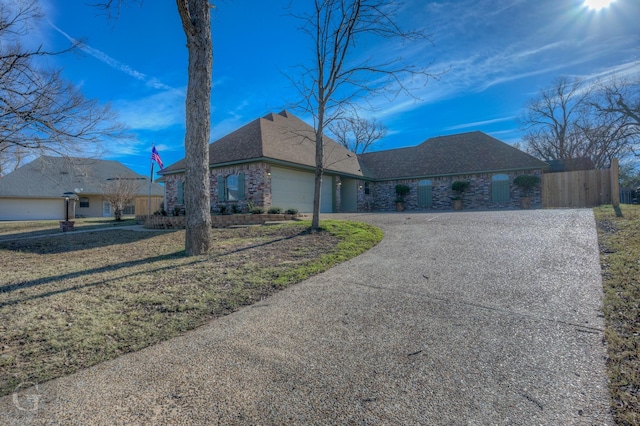 view of side of home featuring a garage