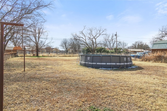 view of yard featuring a fenced in pool