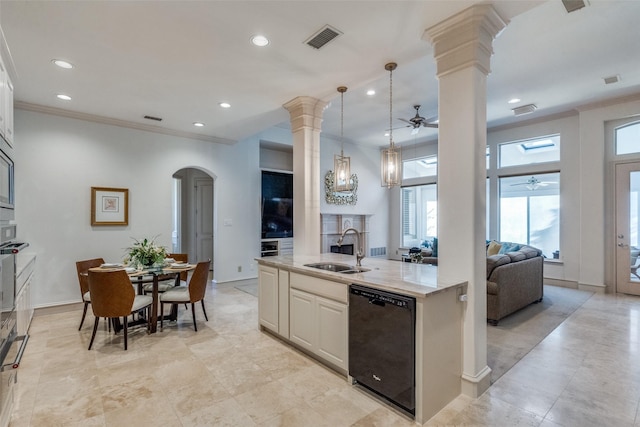 kitchen featuring dishwasher, hanging light fixtures, crown molding, light stone counters, and sink