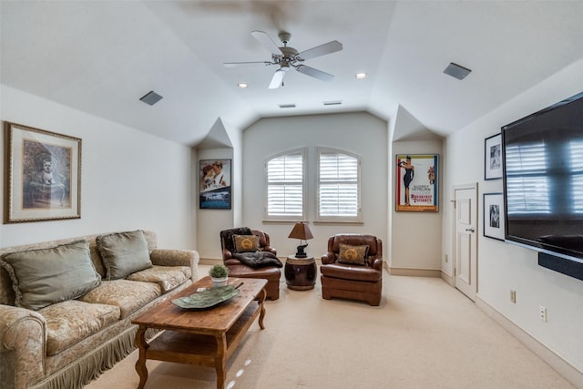 carpeted living room featuring ceiling fan and vaulted ceiling