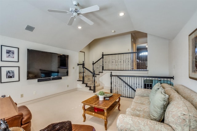 carpeted living room featuring ceiling fan and lofted ceiling