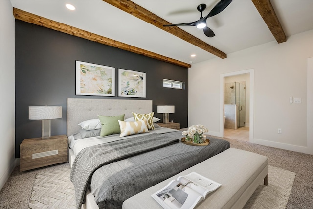 bedroom featuring light colored carpet, beam ceiling, ceiling fan, and connected bathroom