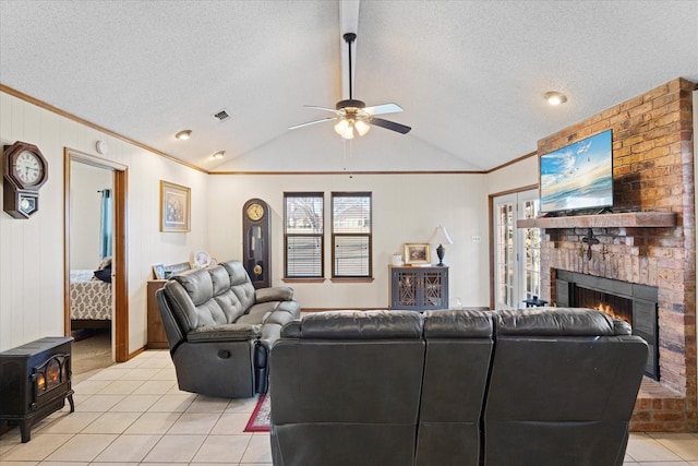 living room featuring lofted ceiling, a textured ceiling, and light tile patterned floors