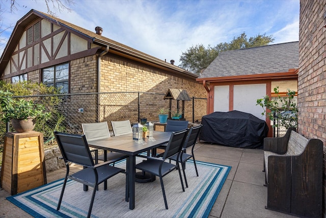 view of patio with a grill