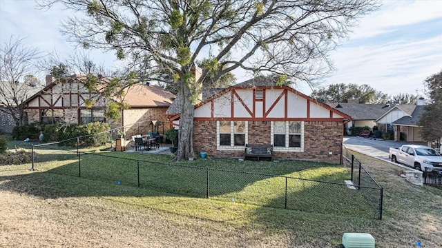 back of house featuring a yard and a patio