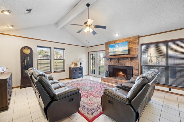 living room featuring a textured ceiling, ceiling fan, lofted ceiling with beams, and light tile patterned floors