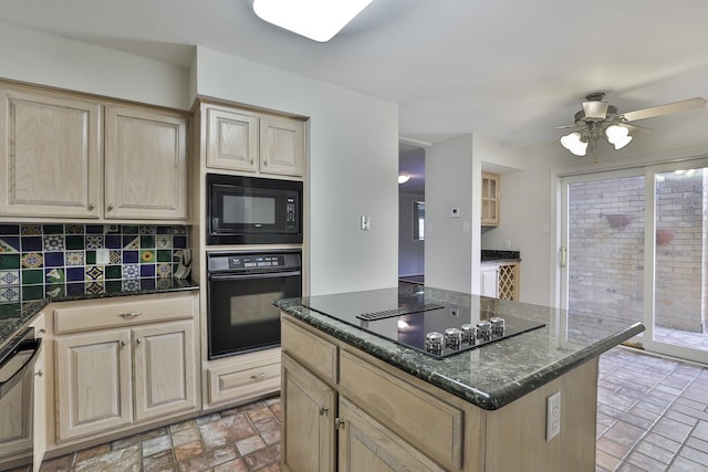 kitchen featuring black appliances, a center island, dark stone counters, light brown cabinets, and backsplash