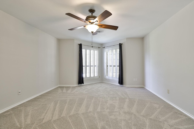 carpeted empty room with ceiling fan