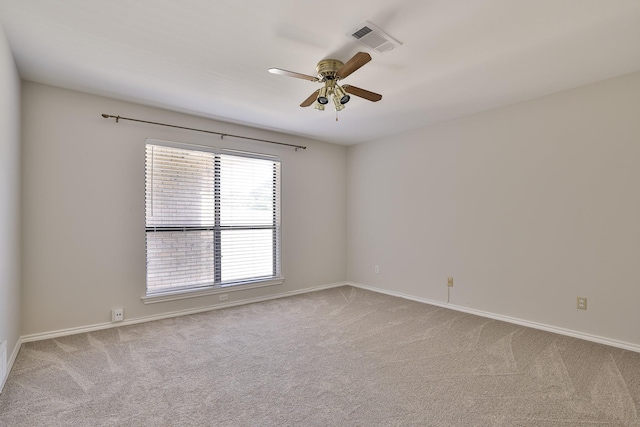 empty room with light carpet and ceiling fan