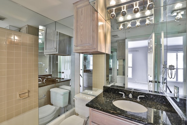 bathroom with toilet and vanity