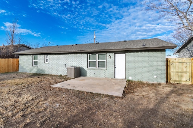 back of house featuring central AC unit and a patio