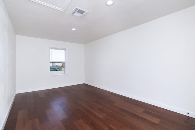 spare room featuring dark hardwood / wood-style floors