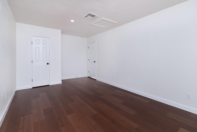 spare room featuring dark hardwood / wood-style floors