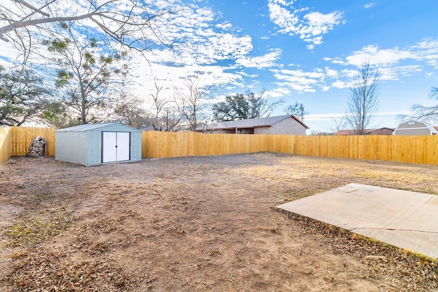 view of yard featuring a patio and a shed