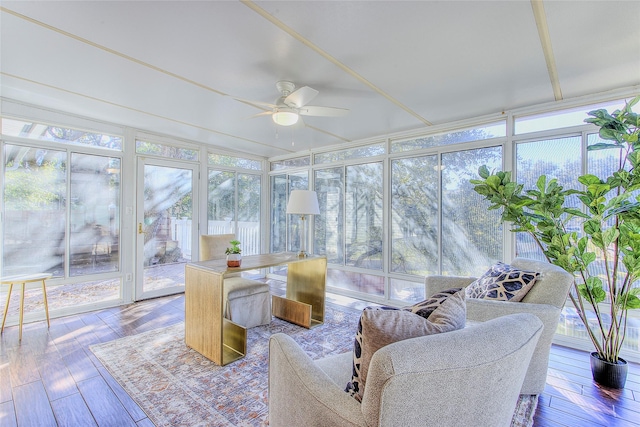 sunroom / solarium featuring ceiling fan and plenty of natural light