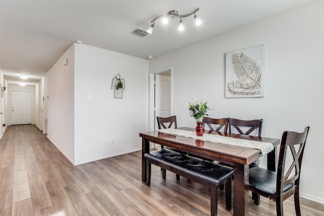 dining room featuring light hardwood / wood-style floors