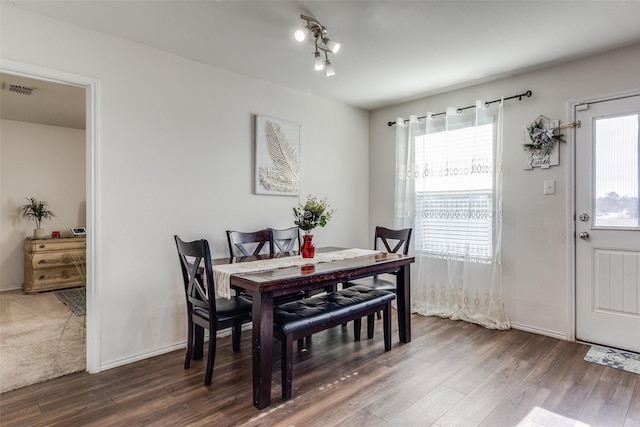 dining space featuring dark hardwood / wood-style flooring