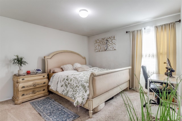 carpeted bedroom with multiple windows