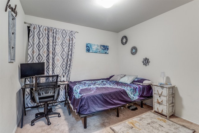 bedroom featuring carpet