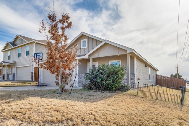 view of front of home with a front lawn and a garage