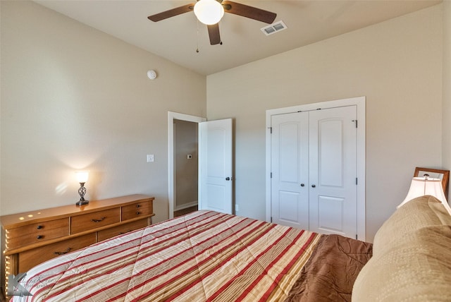 bedroom with ceiling fan and a closet