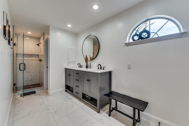 bathroom with vanity and a shower with shower door